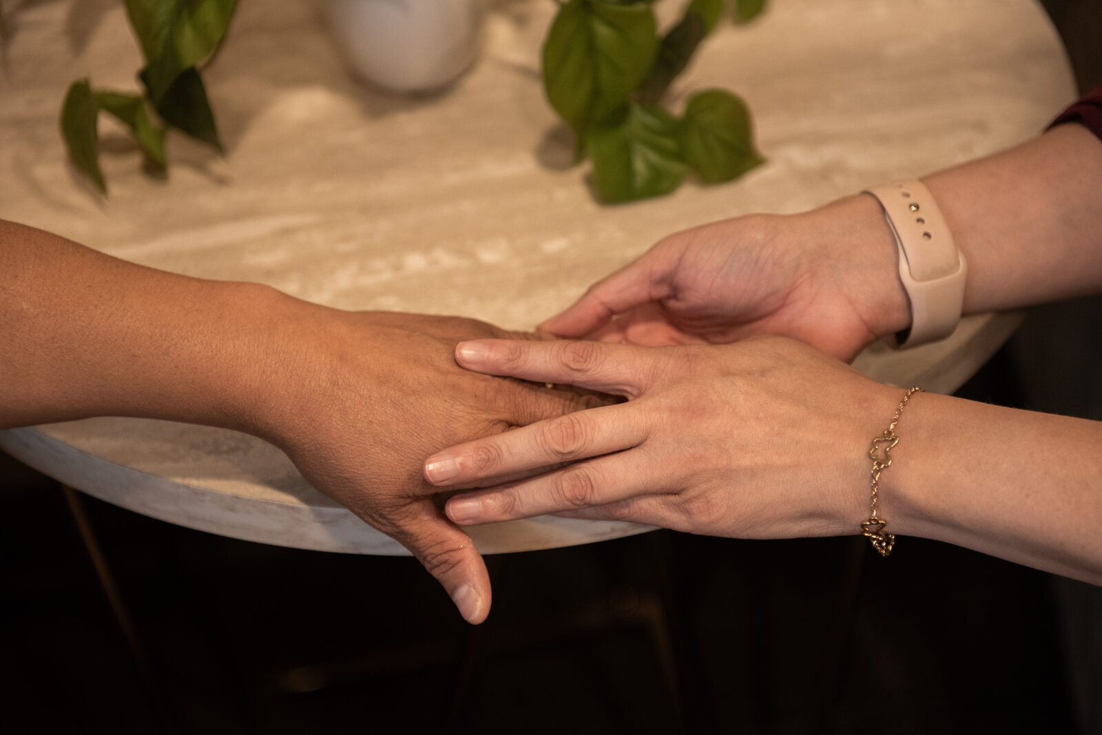 Dr. Katya's hand resting on a patient's hand