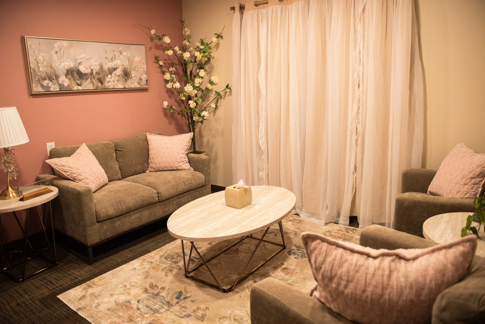 Waiting room with sofas and a round table